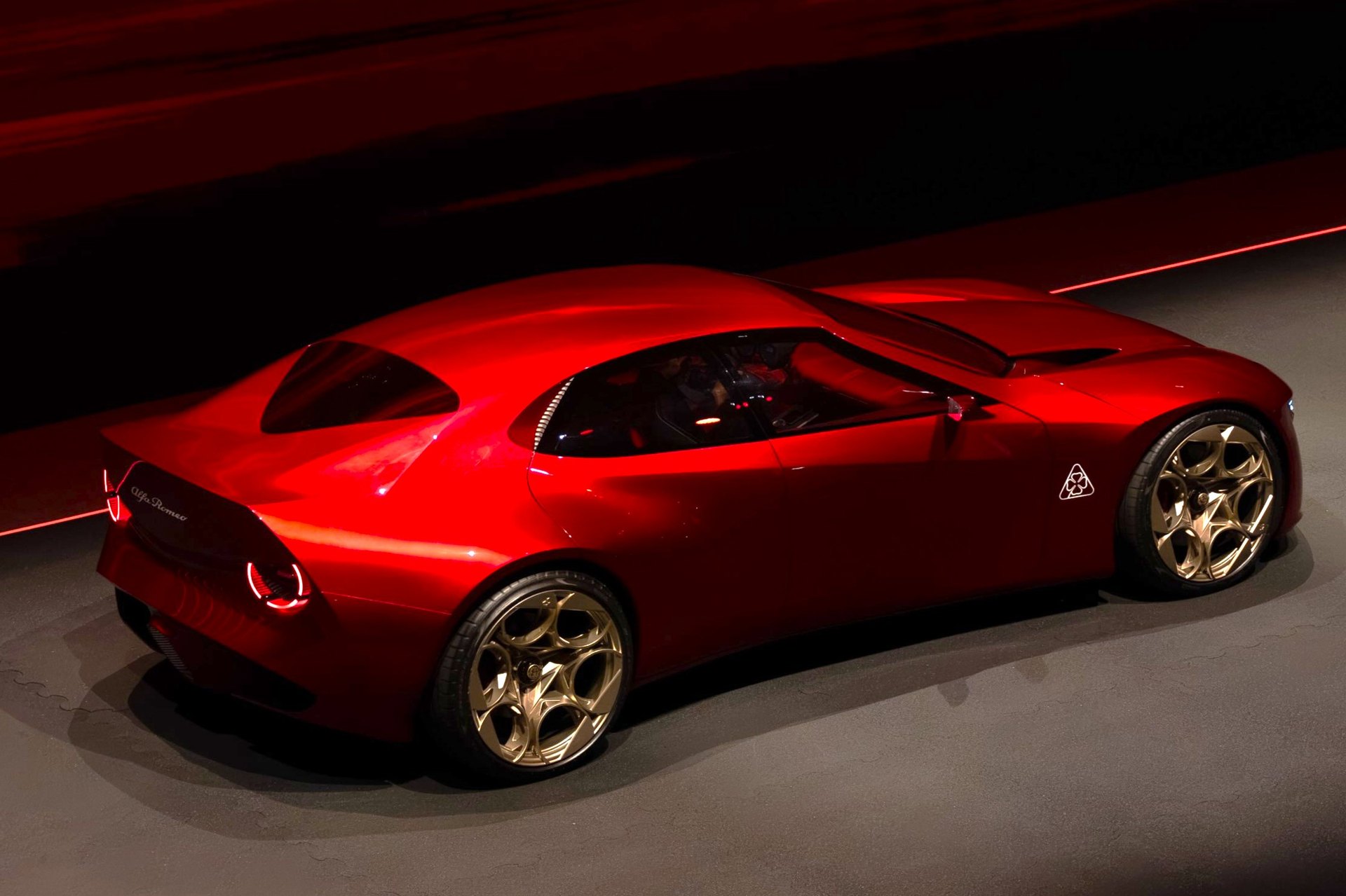 The coda tronca itself: the tail stops in a near-vertical wall rather than tapering away. Alfa credits the truncation, the uninterrupted body surface and a diffuser buried low in the bodywork for the concept's 0.28 drag coefficient.