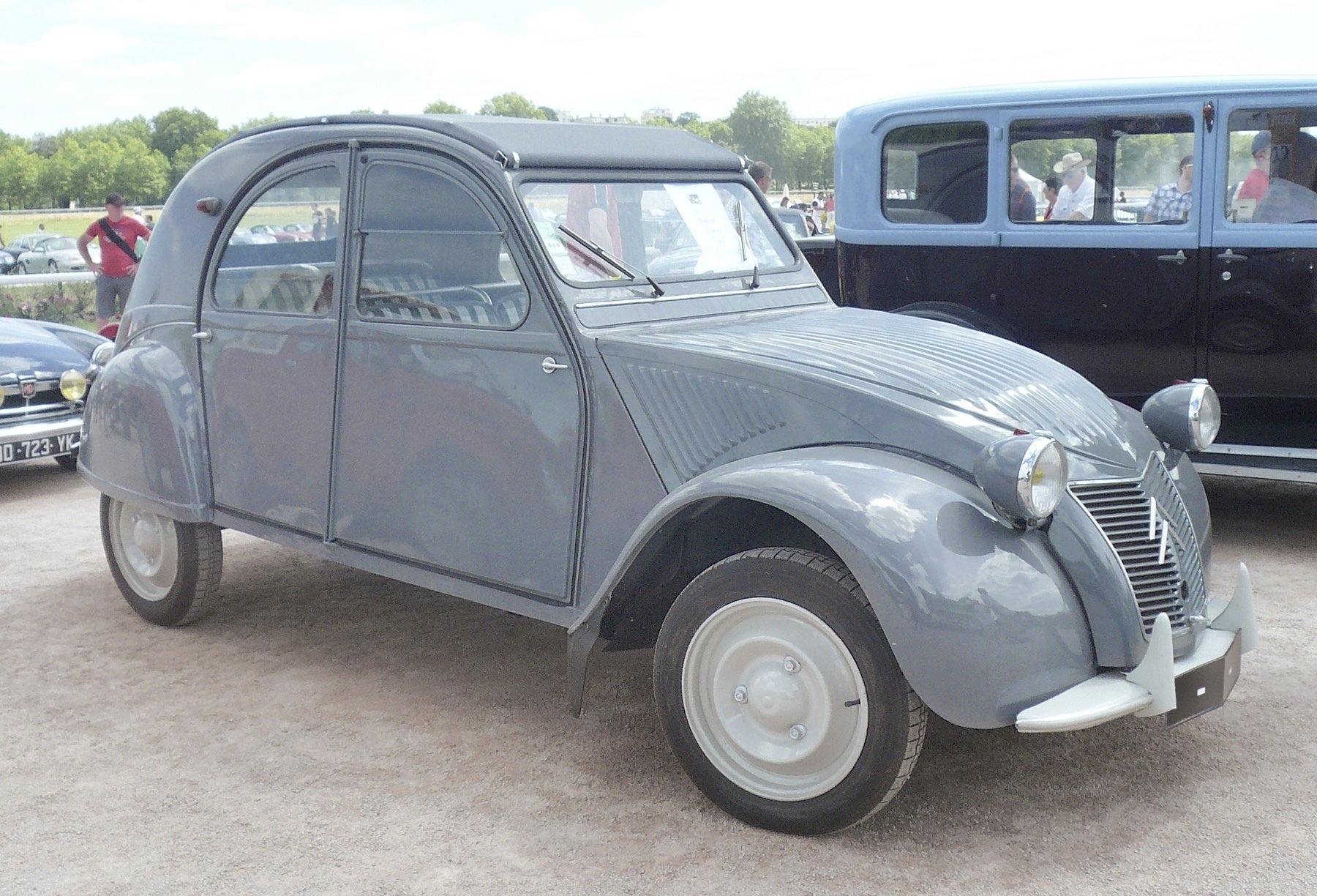 The corrugated bonnet of an early 2CV A/AZ. The ripples were structural stiffening on thin steel, not decoration; Citroën replaced them with a five-rib pressing in 1960.