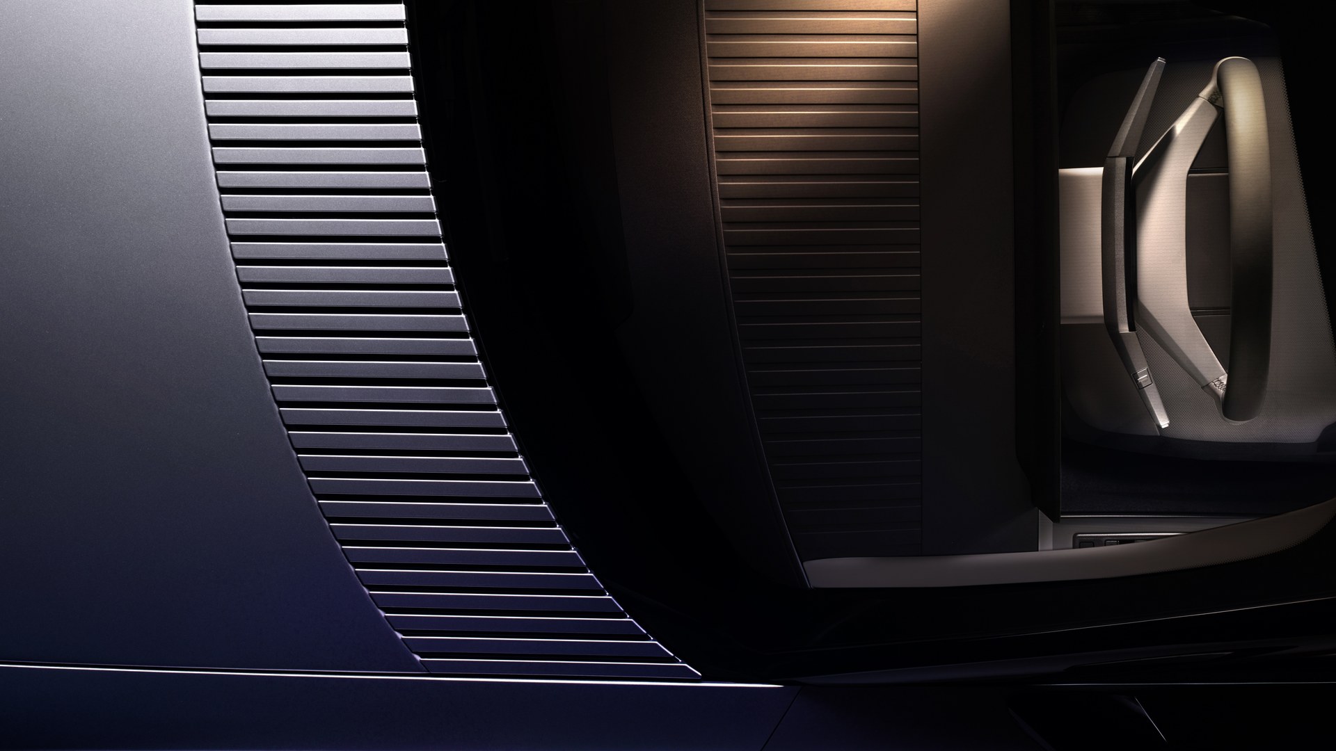A detail shot from the same release: fluted metal against the brass-inspired finish Jaguar repeats along the spine and the tops of the doors.