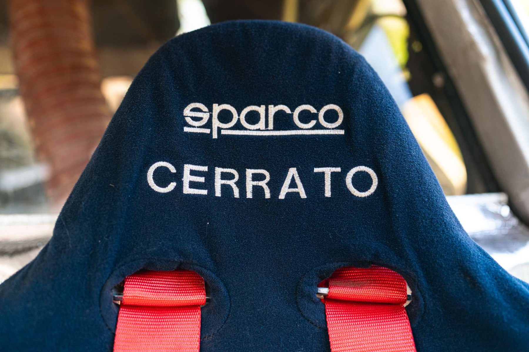 Dario Cerrato's name is still stitched into the Sparco bucket. He won the 1986 Rally 1000 Miglia outright in this car and finished third in it at Rally Costa Smeralda a month later.