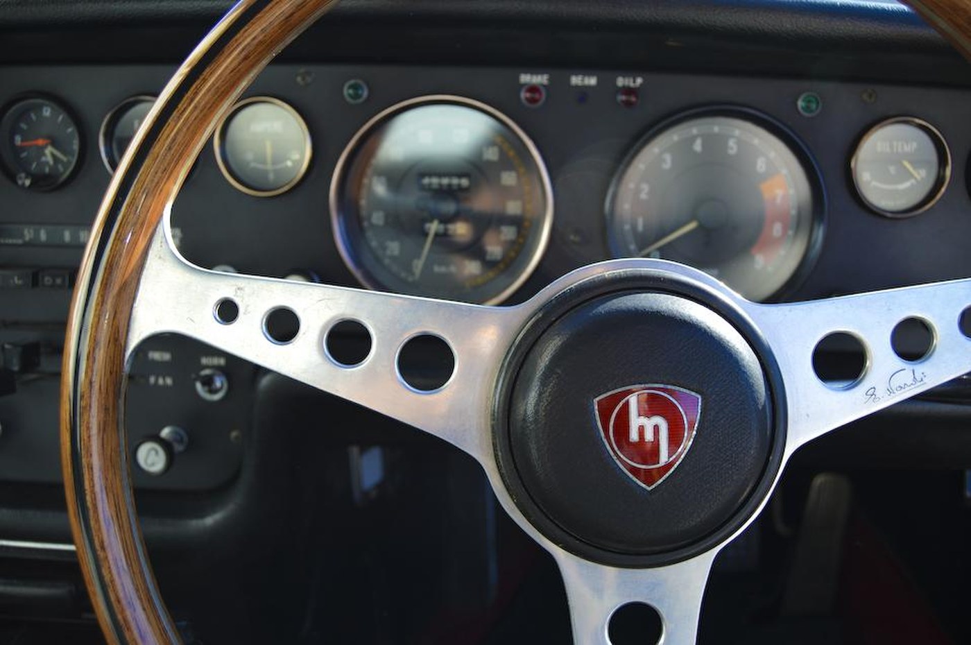 The factory gauge cluster and a period Nardi wheel — the one non-original piece on an otherwise remarkably untouched car.
