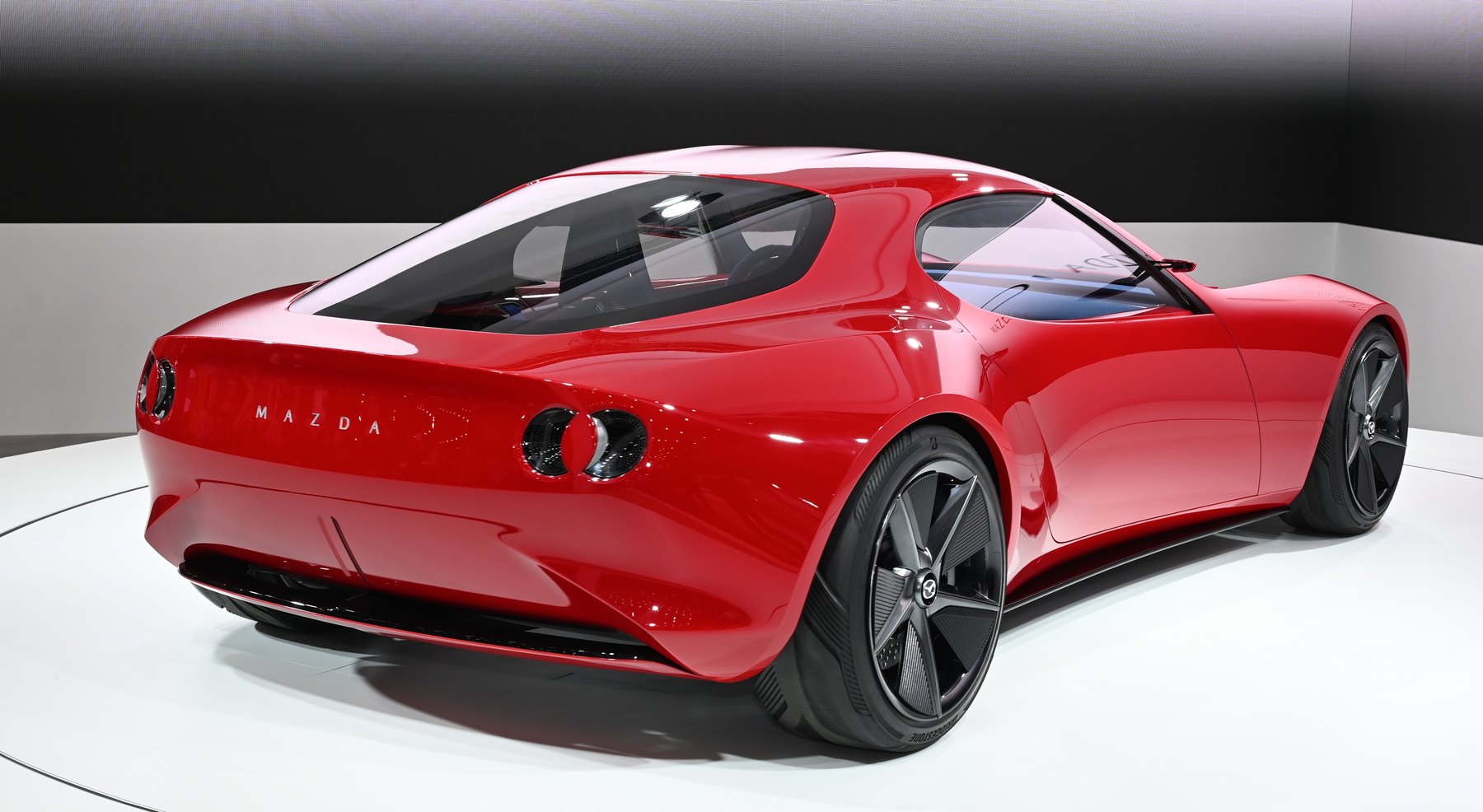 The Iconic SP from behind. Mazda has never committed the car to production, and nothing the company has said about the next rotary names it — but it is the only running statement Mazda has made about what a rotary sports car would look like.