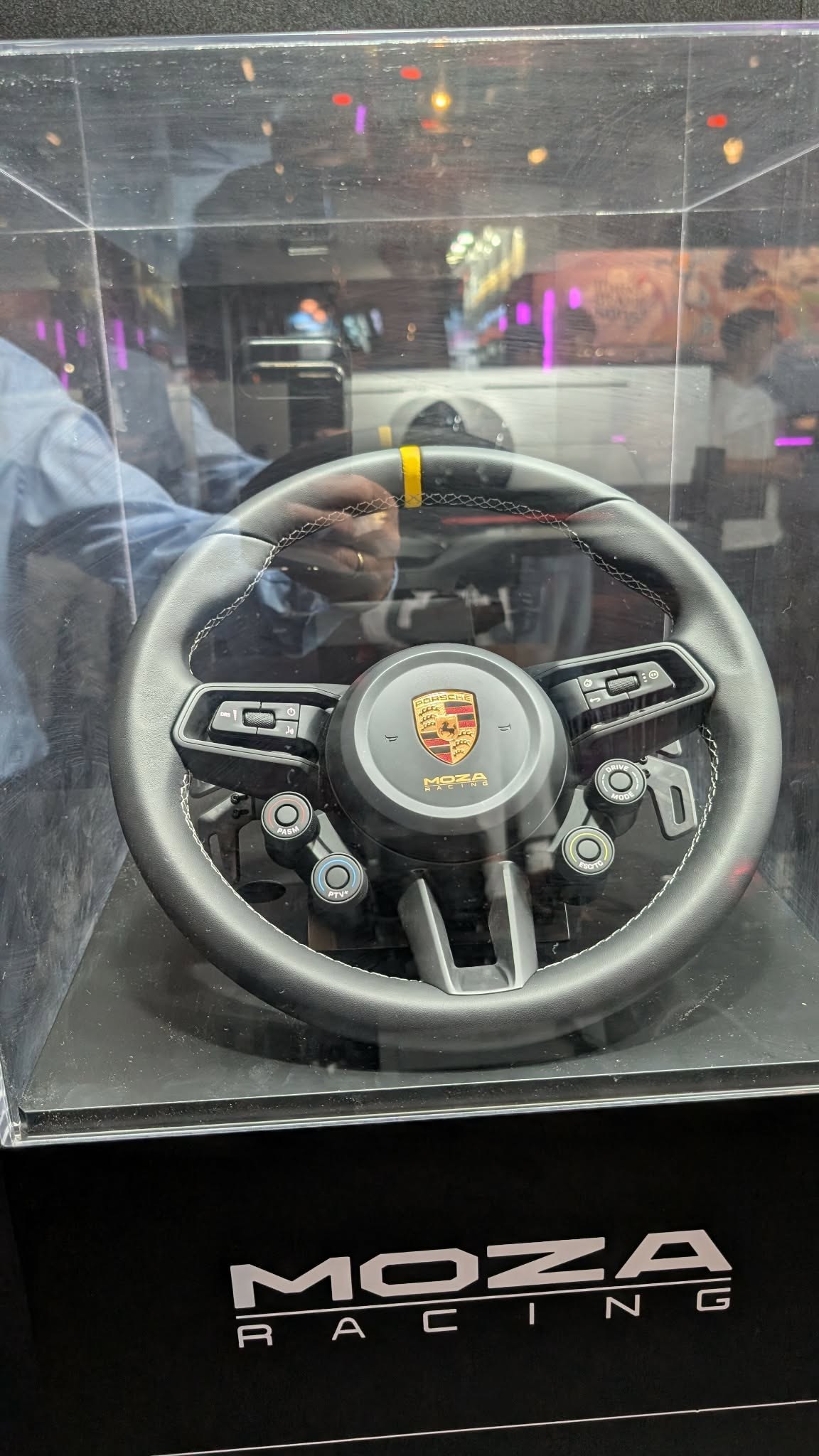 MOZA's Porsche 911 GT3 RS wheel, rebuilt from original Porsche CAD data. The centre display now detaches, and there is a working horn button in the middle.